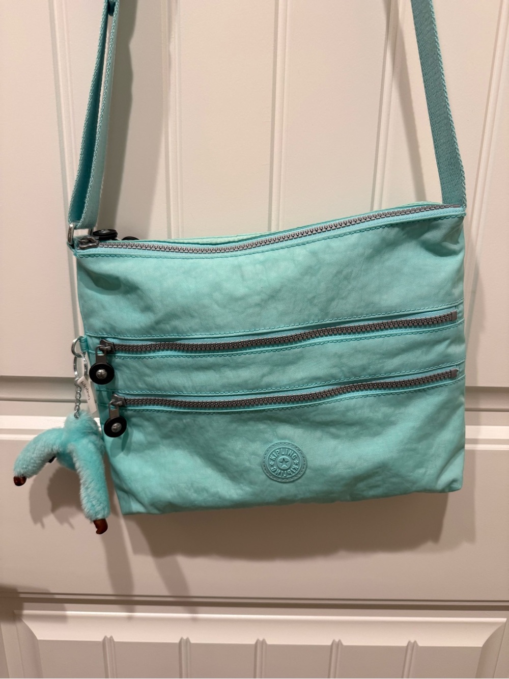 Kipling Mint Green Crossbody Bag with Plush Charm
